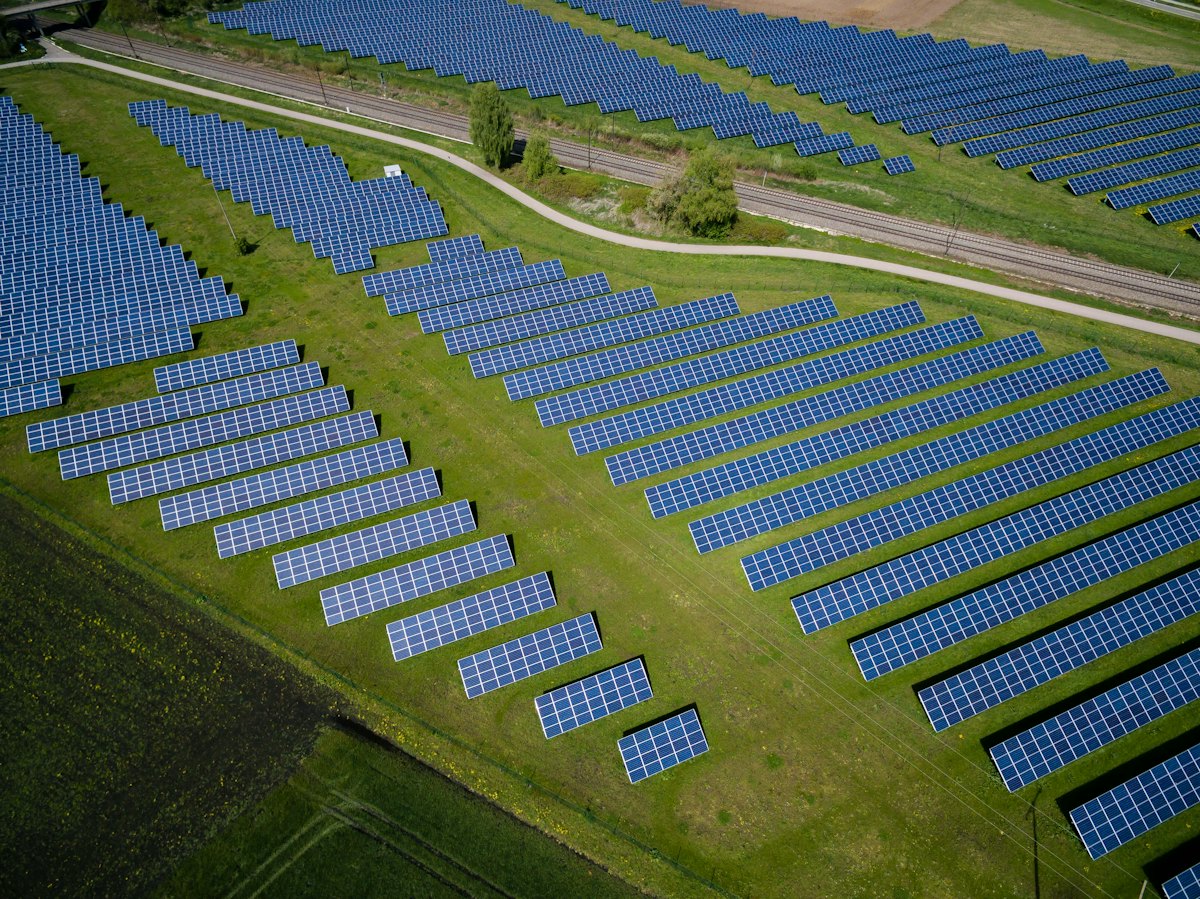 Solar panels in a green field